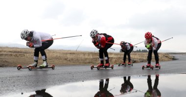 Members of Türkiye’s national cross-country skiing team train on roller skis for the upcoming international competitions and qualification for the 25th Winter Olympic Games at Kandilli Ski Center, Erzurum, Türkiye, Nov. 16, 2025. (AA Photo)