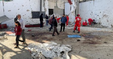Paramedics and people gather at the site of the Israeli strike that killed several people inside the Ain al-Hilweh Palestinian refugee camp in the southern city of Sidon, Lebanon, Nov. 19, 2025. (Reuters Photo)