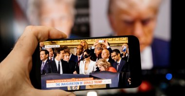 Meta CEO Mark Zuckerberg, Amazon founder Jeff Bezos, Google CEO Sundar Pichai, alongside Affinity Partners founder and son-in-law of U.S. President Donald Trump, Jared Kushner, are seen on a phone display at Trump&#039;s inauguration, Jan. 21, 2025. (Shutterstock Photo)
