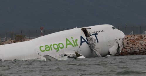 A cargo airplane remains on the water after skidding off the runway at Hong Kong International Airport in Hong Kong, China, Oct. 20, 2025. (EPA Photo)