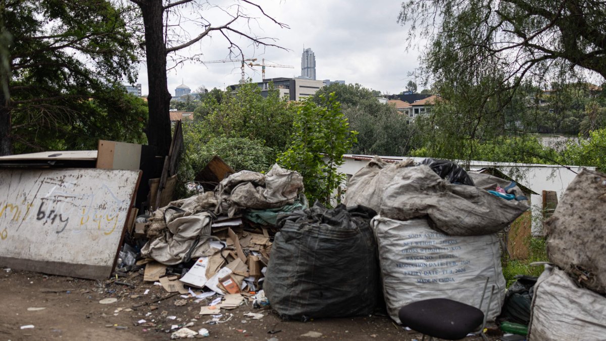 The Sandton skyline overlooks an informal settlement in Innesfree Park in Johannesburg, South Africa, Nov. 14, 2025. (AFP Photo)