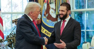 U.S. President Donald Trump (L) shakes hands with Syrian President Ahmed al-Sharaa at the White House, Washington, U.S., Nov. 10, 2025. (AFP Photo)