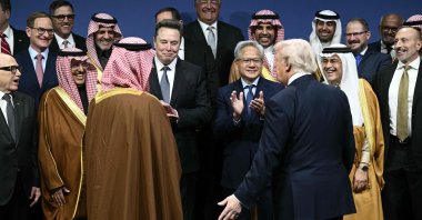 U.S. President Donald Trump (R), Saudi Crown Prince Mohammed bin Salman (L) and other attendees arrive for a family picture the U.S.-Saudi Investment Forum, Washington, U.S., Nov. 19, 2025. (AFP Photo)