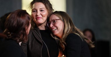 Laura Bloom McGee (C) and Annie Farmer (R), survivors of convicted sex offender Jeffrey Epstein, react after receiving word that the U.S. Senate unanimously approved release of the Epstein files on Capitol Hill, Washington, D.C., U.S., Nov. 18, 2025. (AFP Photo)
