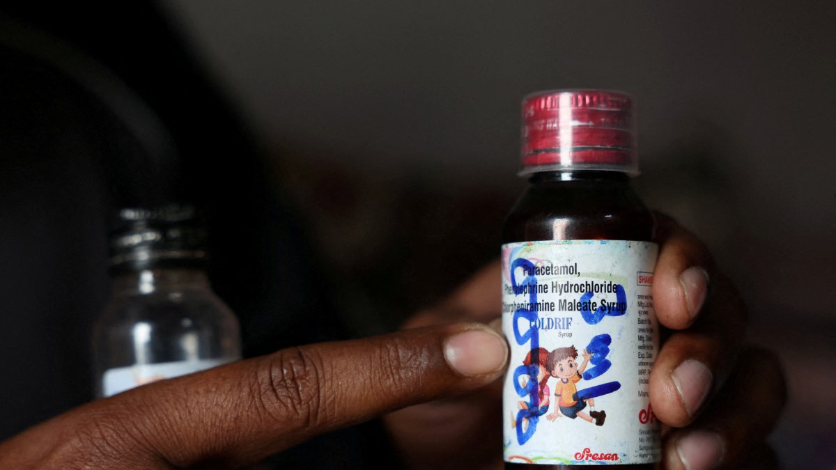 Saddam Mansuri shows a bottle of Coldrif cough syrup, which has been linked to the deaths of multiple children and which he had been giving to his one-year-old child, in Parasia, Madhya Pradesh, India, Oct. 10, 2025. (Reuters Photo)