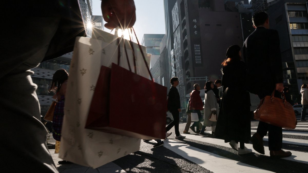 Pedestrians make their way through a shopping district in Tokyo, Japan, Nov. 21, 2025. (Reuters Photo)
