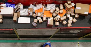 Parcels are seen on a conveyor belt at a postal sorting center of Belgian postal operator Bpost, Brussels, Belgium, Nov. 30, 2020. (Reuters Photo)