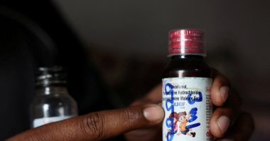 Saddam Mansuri shows a bottle of Coldrif cough syrup, which has been linked to the deaths of multiple children and which he had been giving to his one-year-old child, in Parasia, Madhya Pradesh, India, Oct. 10, 2025. (Reuters Photo)