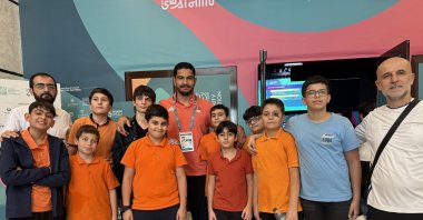 Turkish Wrestling Federation President Taha Akgül (C) poses for a photo with Team Türkiye at the 6th Islamic Solidarity Games, Riyadh, Saudi Arabia, Nov. 20, 2025. (AA Photo)