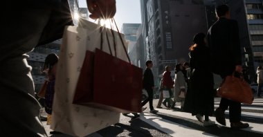 Pedestrians make their way through a shopping district in Tokyo, Japan, Nov. 21, 2025. (Reuters Photo)