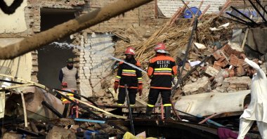 Rescuers work at the explosion site of a chemical factory in Faisalabad, Punjab province, Pakistan, Nov. 21, 2025. (DHA via Xinhua)