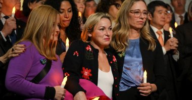 Jeffrey Epstein survivors Danielle Bensky and Liz Stein hold electric candles as they react to the Senate&#039;s passing of the bill to force the release of files related to the late convicted sex offender Jeffrey Epstein, Capitol Hill in Washington, D.C., U.S., Nov. 18, 2025. (Reuters Photo)