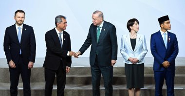 Turkish President Recep Tayyip Erdoğan (C), Japan&#039;s Prime Minister Sanae Takaichi (2nd R) and Indonesia&#039;s Vice President  Gibran Rakabuming Raka (R) pose for a family photo event during a G-20 Leaders&#039; Summit plenary session at the Nasrec Expo Centre in Johannesburg, South Africa, Nov. 22, 2025. (AFP Photo)
