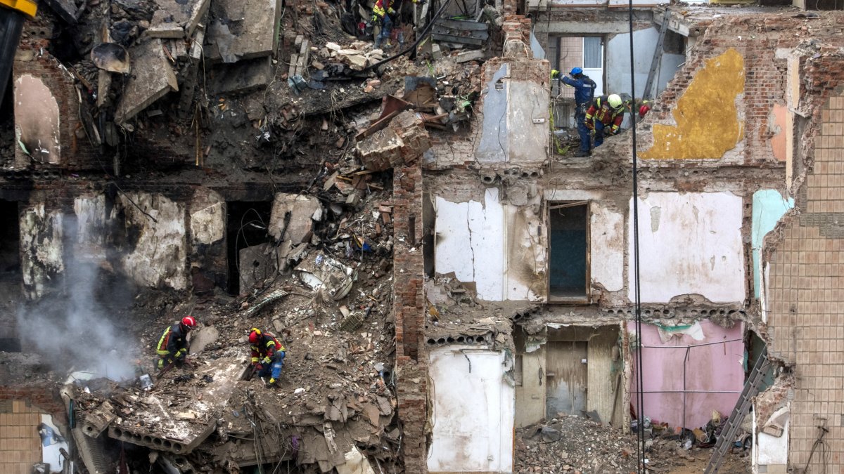Ukrainian rescuers work at the site of a Russian strike on a high-rise residential building in Ternopil, western Ukraine, Nov. 21, 2025. (EPA Photo)
