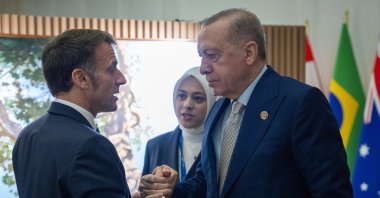 President Recep Tayyip Erdoğan shakes hands with President Macron during their meeting, Johannesburg, South Africa, Nov. 23, 2025. (IHA Photo)