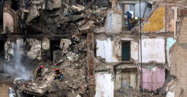 Ukrainian rescuers work at the site of a Russian strike on a high-rise residential building in Ternopil, western Ukraine, Nov. 21, 2025. (EPA Photo)