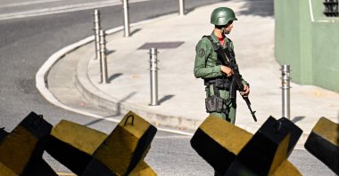 A Venezuelan army soldier guards a street, Caracas, Venezuela, Nov. 13, 2025. (AFP Photo)