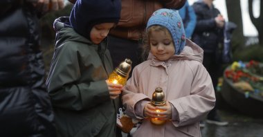 Ukrainians attend a commemorative prayer at the Holodomor Genocide complex of the National Museum in Kyiv, Ukraine, Nov. 22, 2025. (EPA Photo)