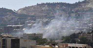 Smoke is seen near the Syrian Army General Command headquarters, Damascus, Syria, July 16, 2025. (DHA Photo)