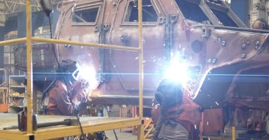 Employees work on an armored vehicle at the factory of the Turkish automotive and defense company Otokar, Sakarya, Türkiye, Nov. 5, 2025. (AA Photo)