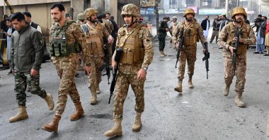 Army personnel inspect the suicide attack site outside the border force headquarters in Peshawar, Pakistan, Nov. 24, 2025. (AFP Photo)
