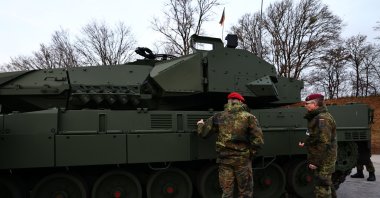 Soldiers discuss the Leopard 2A8 main battle tank during a rollout event, Munich, Germany, Nov. 19, 2025. (EPA Photo)