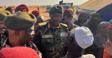 Sudanese Armed Forces chief Gen. Abdel-Fattah Burhan (C) meet with war-displaced people in al Dabbah, Sudan, Nov. 8, 2025. (AA Photos)