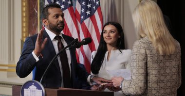 U.S. Attorney General Pam Bondi swears in the new FBI Director Kash Patel as his girlfriend Alexis Wilkins (C) holds the Bhagavad Gita in the Indian Treaty Room in the Eisenhower Executive Office Building, in Washington, D.C., U.S., Feb. 21, 2025. (Getty Images)