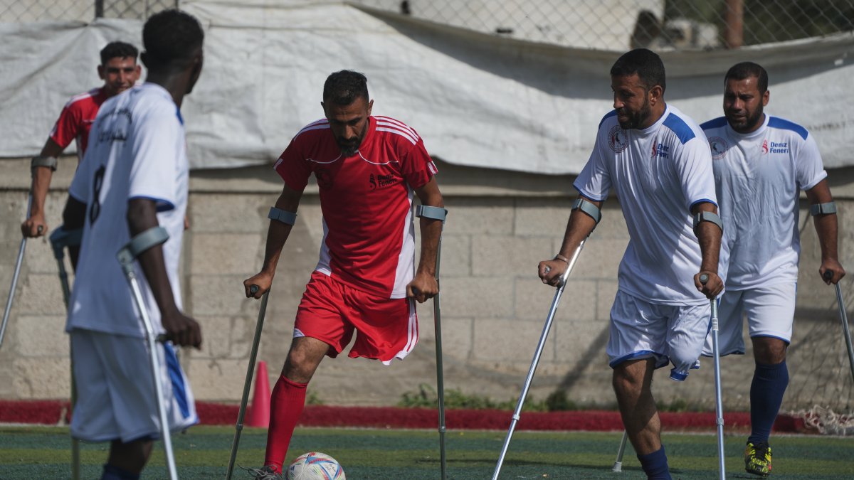 Palestinians, some of whom were injured in previous conflicts and others in the current Israeli bombardments on Gaza, take part in a football tournament for amputees, Deir al-Balah, Gaza Strip, Palestine, Nov. 17, 2025. (AP Photo)