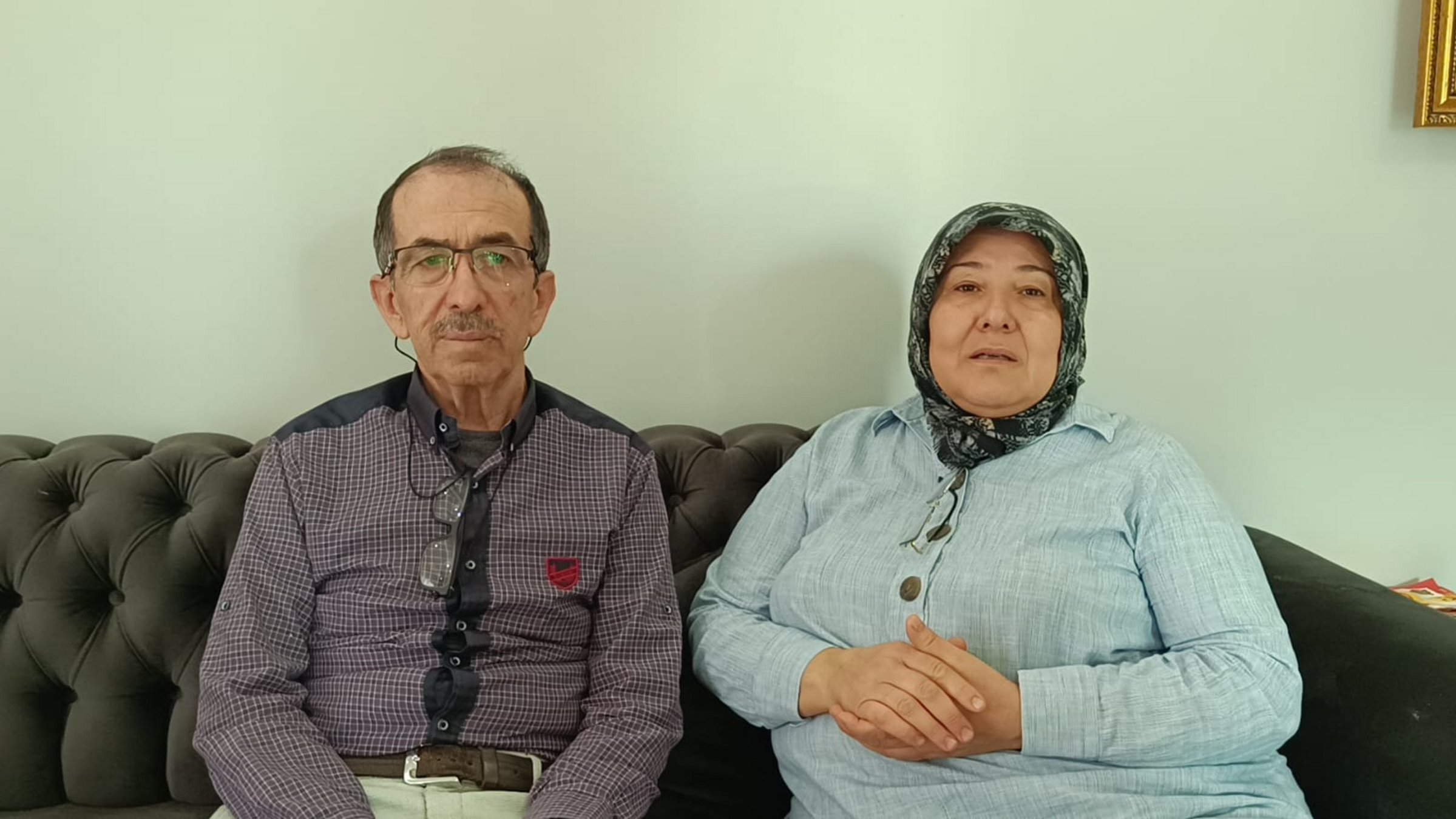 Parents of Turkish scientist Furkan Dölek, Hasan (L) and Zuhal Dölek, speak at their home in Kozan, Adana, southern Türkiye, Nov. 7, 2025. (AA Photo)