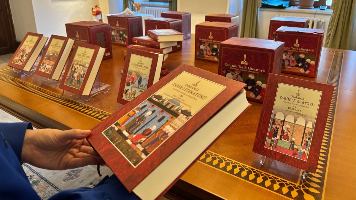A visitor examines the newly unveiled six-volume “Ottoman Historical Literature” during a conference at the Research Centre for Islamic History, Art and Culture (IRCICA) headquarters in Cağaloğlu, Istanbul, Türkiye, Nov. 25, 2025. (AA Photo)