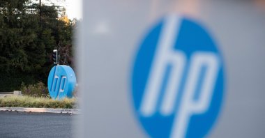 The HP logo is seen on a sign at Hewlett-Packard&#039;s headquarters in Palo Alto, California, U.S., Nov. 4, 2016. (AFP Photo)