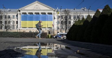 A resident walks at a square, amid Russia&#039;s attack on Ukraine, in Zaporizhzhia, Ukraine, Nov. 25, 2025. (Reuters Photo)