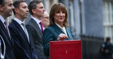 British Chancellor of the Exchequer Rachel Reeves poses with the red budget box outside her office in Downing Street, London, Britain, Nov. 26, 2025. (Reuters Photo)