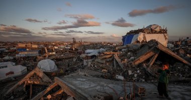 A young displaced Palestinian boy looks on after heavy rain in Jabalia city, northern Gaza Strip, Nov. 25, 2025. (AFP Photo)