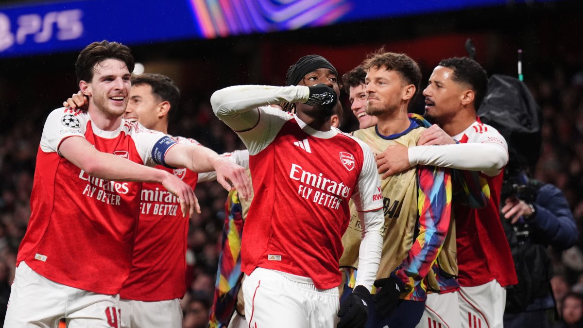 Arsenal's Noni Madueke (C) celebrates after scoring his side's second goal during the Champions League league phase match against Bayern Munich, London, U.K., Nov. 26, 2025. (AP Photo)