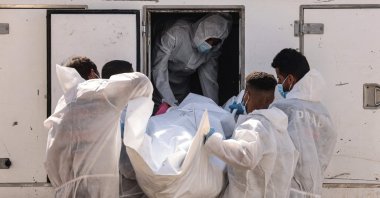 Employees of the Nasser Medical Complex unload one of the thirty bodies of Palestinian prisoners detained by Israel and released as part of the hostage exchange deal, in Khan Yunis, in the southern Gaza Strip, Palestine, Oct. 31, 2025. (AFP Photo)