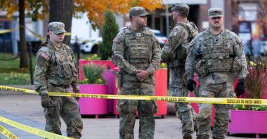 National Guard members stand together behind yellow tape, after two National Guard members were shot near the White House in Washington, D.C., U.S., Nov. 26, 2025. (Reuters Photo)