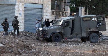 Israeli soldiers detain Palestinians during a raid in the Jenin refugee camp in the occupied West Bank, Nov. 27, 2025. (AFP Photo)