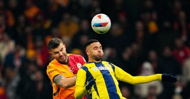 Galatasaray&#039;s Abdülkerim Bardakcı (L) and Fenerbahçe&#039;s Youssef En-Nesyri battle for the ball during the Süper Lig match at RAMS Park, Istanbul, Türkiye, Feb. 24, 2025. (Getty Images Photo)