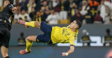 Al-Nassr&#039;s Cristiano Ronaldo (R) kicks the ball to score his team&#039;s fourth goal during the Saudi Pro League football match between Al-Nassr and Al-Khaleej at Al-Awwal Park, Riyadh, Saudi Arabia, Nov. 23, 2025. (AFP Photo)