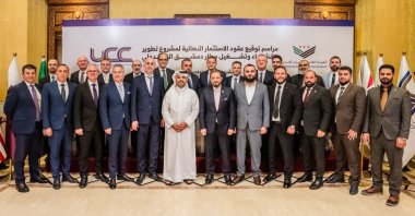 Syrian officials and executives of the firms from the consortium that will develop and expand the capacity of Damascus International Airport pose for a photo, Damascus, Syria, Nov. 27, 2025. (AA Photo)