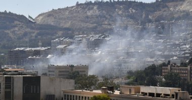 Smoke is seen near the Syrian Army General Command headquarters in Damascus, Syria, after Israeli strikes, July 16, 2025. (Xinhua via DHA)