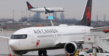 An Air Canada Boeing 737 MAX 8 from San Francisco approaches for landing at Toronto Pearson International Airport over a parked Air Canada Boeing 737 MAX 8 aircraft in Toronto, Ontario, Canada, March 13, 2019. (Reuters File Photo)