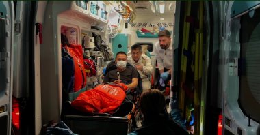Staff of a tanker ship rescued by emergency teams head to hospital on an ambulance, Kocaeli, Nov. 28, 2025. (DHA Photo)