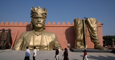 Visitors walk past the set of Bahubali in Ramoji Film City, Hyderabad, India, Nov. 18, 2025. (AP Photo)