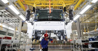 An employee works on a new energy vehicle production line at a BYD factory in Huaian, Jiangsu province, China, Aug. 26, 2024. (Reuters Photo)