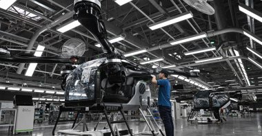 Employees work on the assembly line for the electric flying car &quot;Land Aircraft Carrier” at a factory of Xpeng&#039;s subsidiary Aridge, Guangzhou, China, Nov. 6, 2025. (AFP Photo)