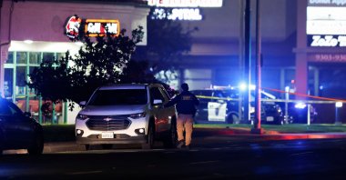 A police officer checks a vehicle after several people were shot at a family gathering in Stockton, California, U.S., Nov. 29, 2025. (Reuters Photo)