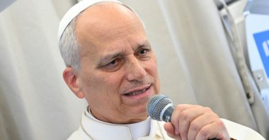Pope Leo XIV answers journalists aboard a flight on his way to Beirut, Lebanon, Nov. 30, 2025. (EPA Photo)